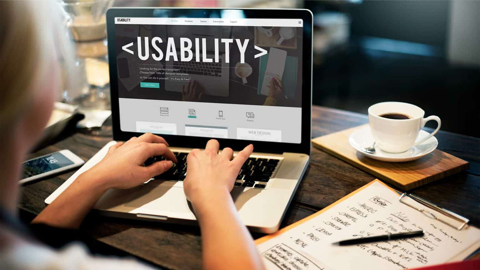 A person using a laptop that reads the text Usability
